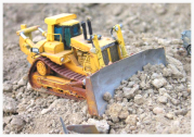 Image of a remote-controlled scale model bull-dozer